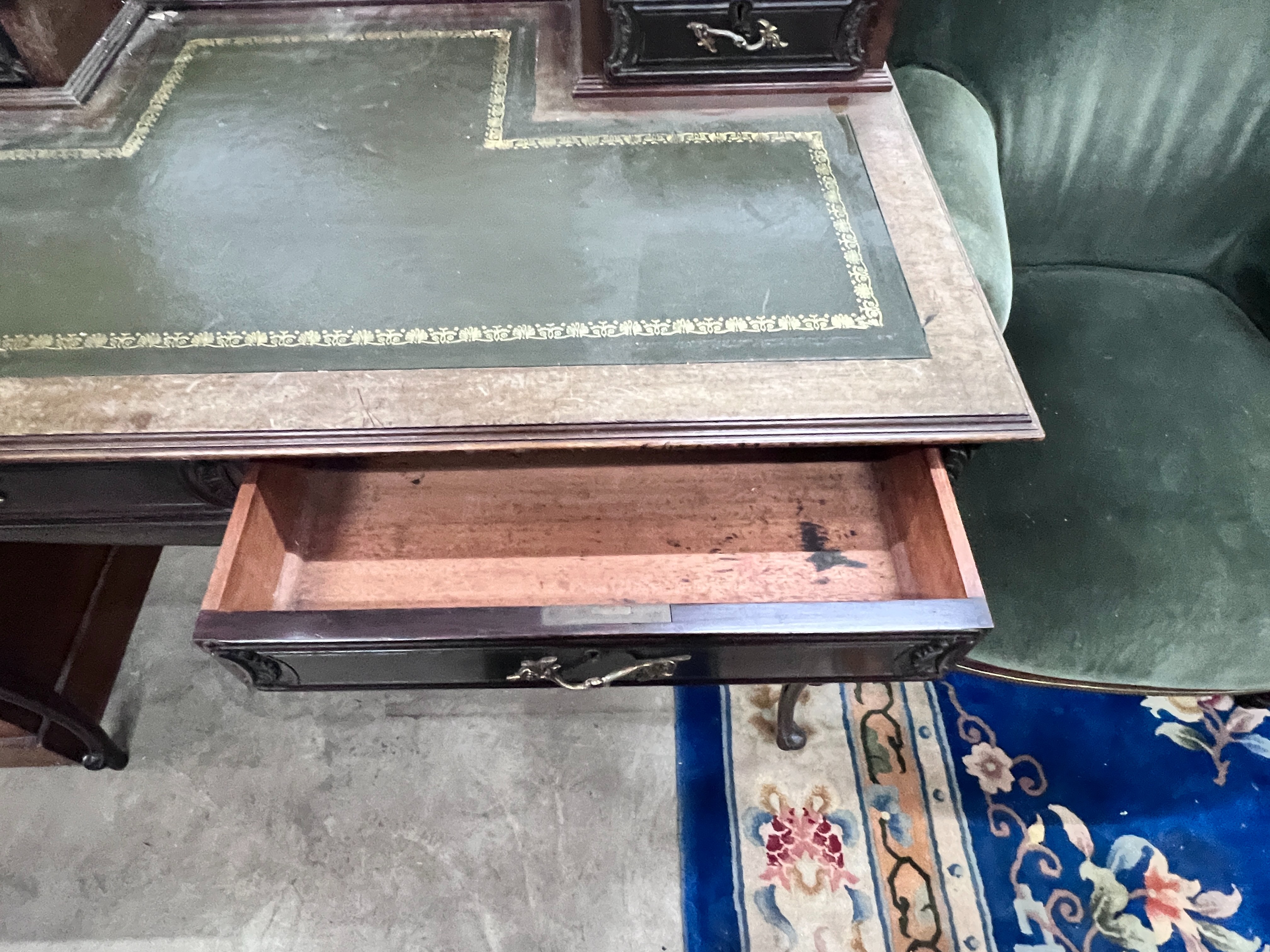 A late Victorian carved mahogany writing desk, length 99cm, depth 58cm, height 88cm